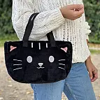 Una bolsa isotérmica con forma de gato negro